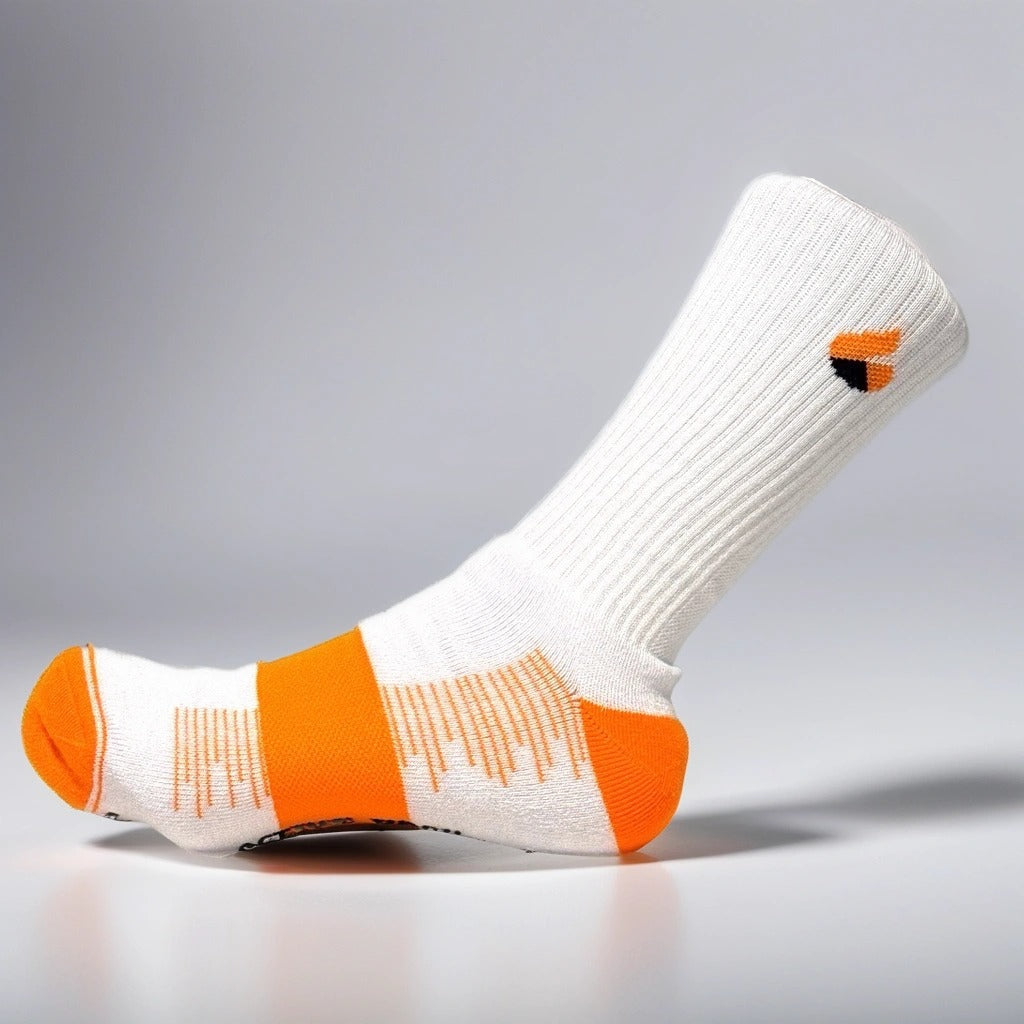 White and orange crew tennis sock with cushioned sole and ankle support made from bamboo yarn