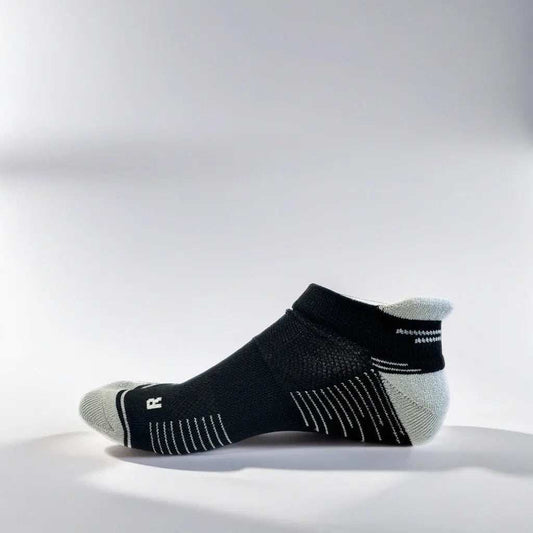 Low cut running socks in black and grey with arch support and ventilation.